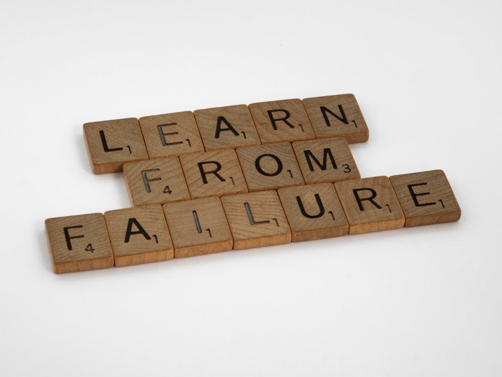 Wooden Scrabble tiles spelling 'Learn from Failure' The Alchemy of Transformation: Turning Failure Into Opportunity